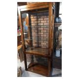 Wooden shelving unit with glass shelves