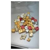 Group of old butterscotch colored dice, solid red