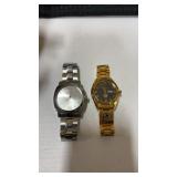 2 watches one pelic silver tone watch and one