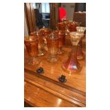 Orange carnival glass cups with handle and candle