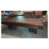 Pool table with pool cue rack and overhead pool