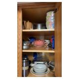 Contents of cabinet: various plastic mugs, mixing