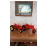 To diecast model tractors, one co-op E3 and one