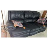 Reclining couch with throw pillows