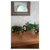 To John Deere diecast tractors, including one