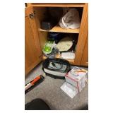 Contents of cabinet: steak knife set, slow cooker