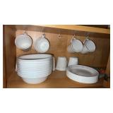 11 Corelle matching small plates and  9 coffee