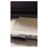 Briefcase from a Garst salesman has various items