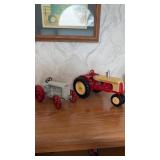 Two model diecast tractors, including Ford, son