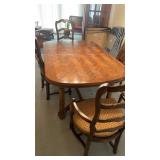Wooden dining room table , 2 captains chairs and