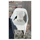 4 lawn chairs. 1 has a small crack