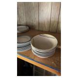 Lots of plates and holes and cups