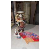 Oriental vase, bells and fan