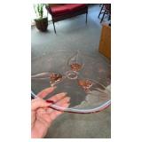 Pink depression glass platter with 3 legs