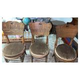 3 Wooden  chairs with cushions.  In basement