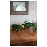 To John Deere diecast tractors, including one
