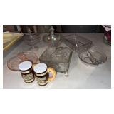 Group of clear glass dishes some covered , pink