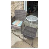 2 outdoor tables and wicker chair
