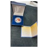 Colorized peace silver dollar in capsule with COA