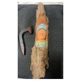 Wood carved railroad conductor and railroad spike