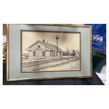 Framed and matted drawing of a train station