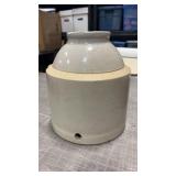 Stoneware chicken waterer  has a crack and a few