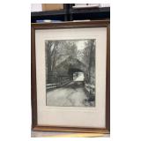 Framed black and white photo of covered bridge
