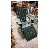 2 green wooden lawn chairs
