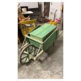 Large green wheelbarrow with chest