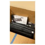 Box of keyboards and toner cartridge