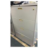 metal 4 drawer file cabinet  contents on top