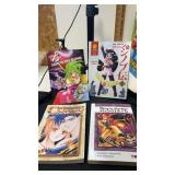 4 miscellaneous paper back books /comics night