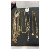 Group of gold tone womanï¿½s necklaces
