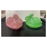 Pink glass Easter rabbit nesting on a basket dish