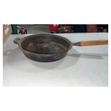 Large cast iron frying pan with wood  handle
