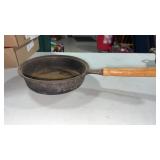 Cast iron small frying pan with wood handle