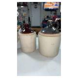 2 crock jugs.  Dose have cracking and chips