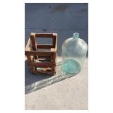 5 gallon glass carboy bottle in wooden crate
