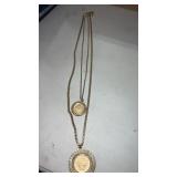 Gold tone necklace featuring 2 medallions  14'