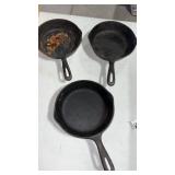 Unable to see marking.  3 cast iron small