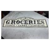 Metal groceries sign approximately 30 ' long