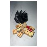 Miscellaneous cream colored dice and pouch