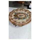 , ceramic floral decorative  plate on brass stand