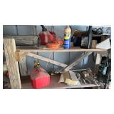 Shelf of miscellaneous items weed eater, string,