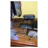 Group of vintage eye glasses and mire