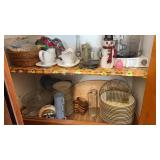 Cupboard of dishes , decorative accent pieces and
