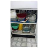 Cupboard of miscellaneous bowls, pants, and more