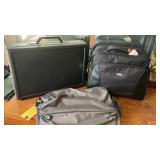 2 traveling bags, and a hard case briefcase