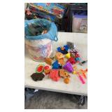 Popcorn tin full of miscellaneous opened happy