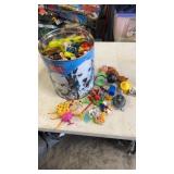 Popcorn tin full of miscellaneous opened happy